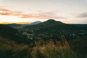 Sunrise view from Mount Batur with mountain landscape and valley in Bali.