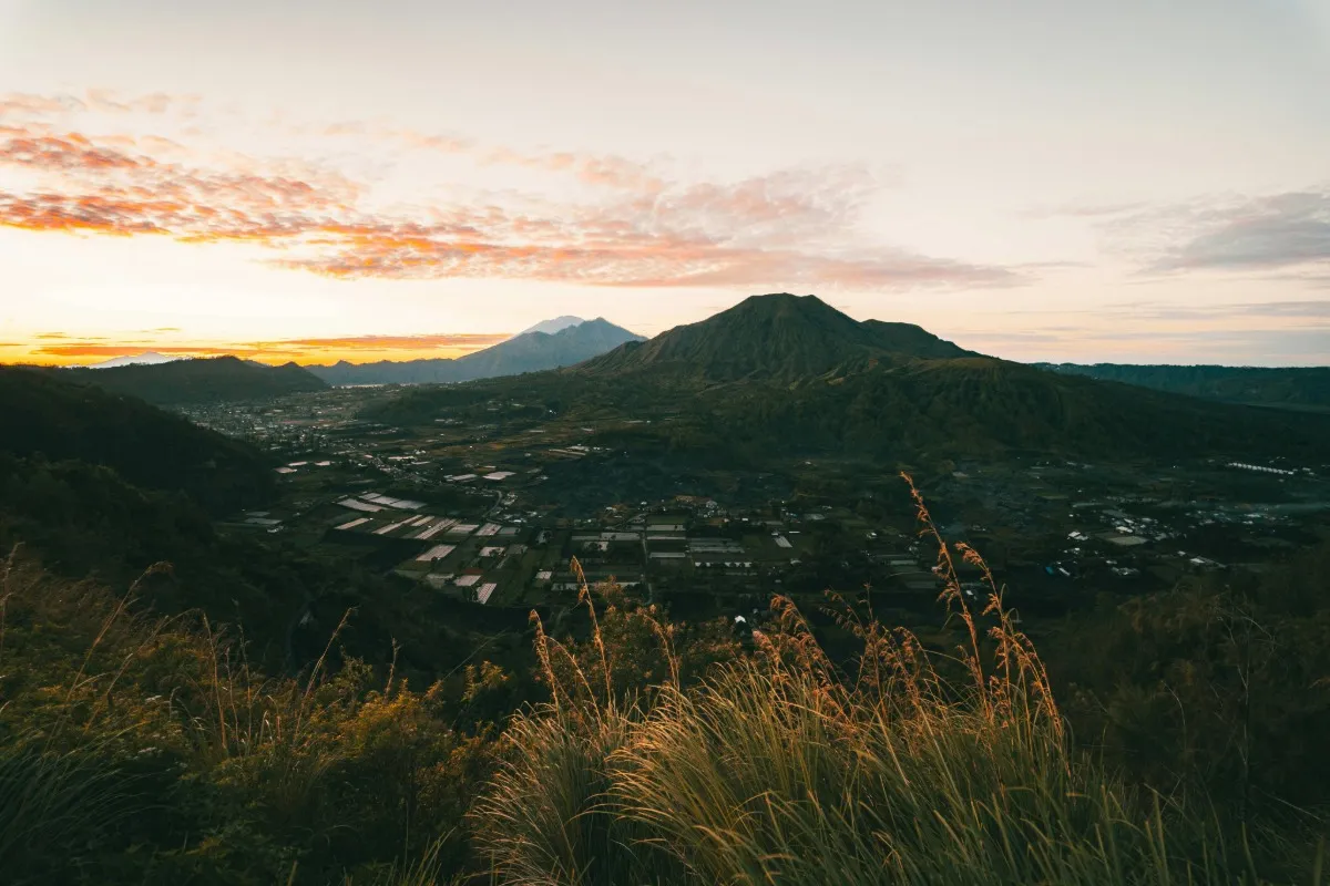 Sunrise view from Mount Batur with mountain landscape and valley in Bali.