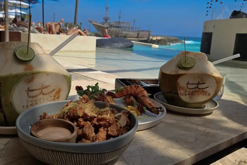 Beachfront food and fresh coconuts served by the pool, perfect for all day dining in Bali.