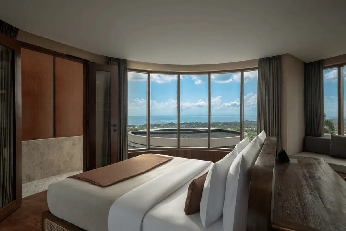Modern Bali villa bedroom with wide ocean views, showing a peaceful stay for a relaxing island holiday.