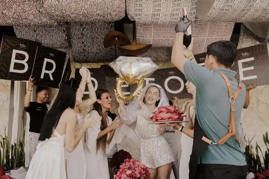 Guests celebrate a private event in Bali with decorations, music, and a festive atmosphere at the venue.